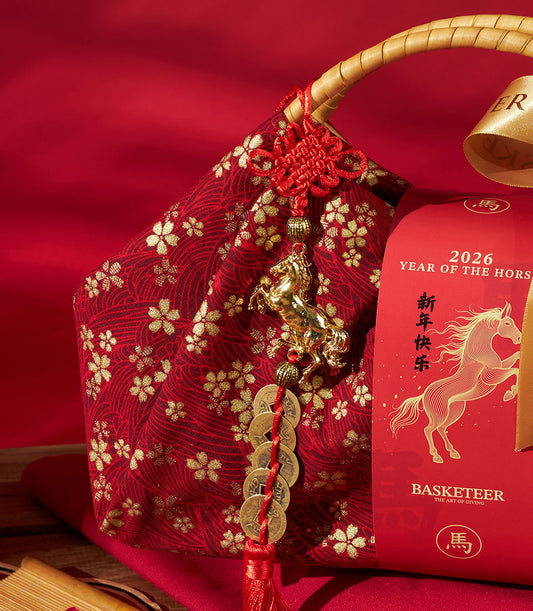 Mandarin oranges luxury gift hamper with red and gold fabric, ceramic horse charm, and Chinese New Year keepsake box