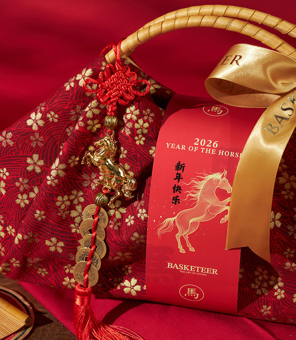 Red fabric gift basket with golden floral pattern for Chinese New Year 2026, featuring embossed ribbon and decorative horse