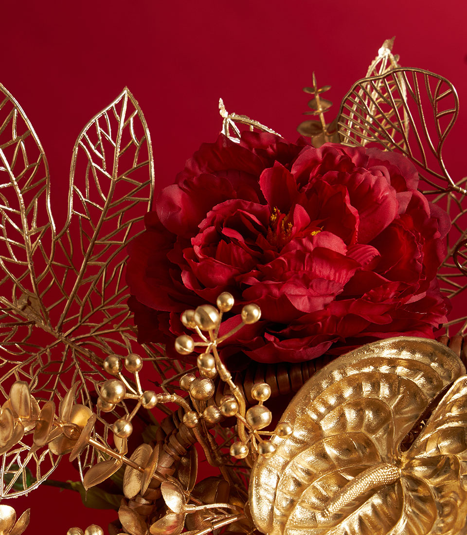 Luxe Chinese New Year mandarin orange gift basket with deep red peony, gold filigree leaves, and festive floral arrangement