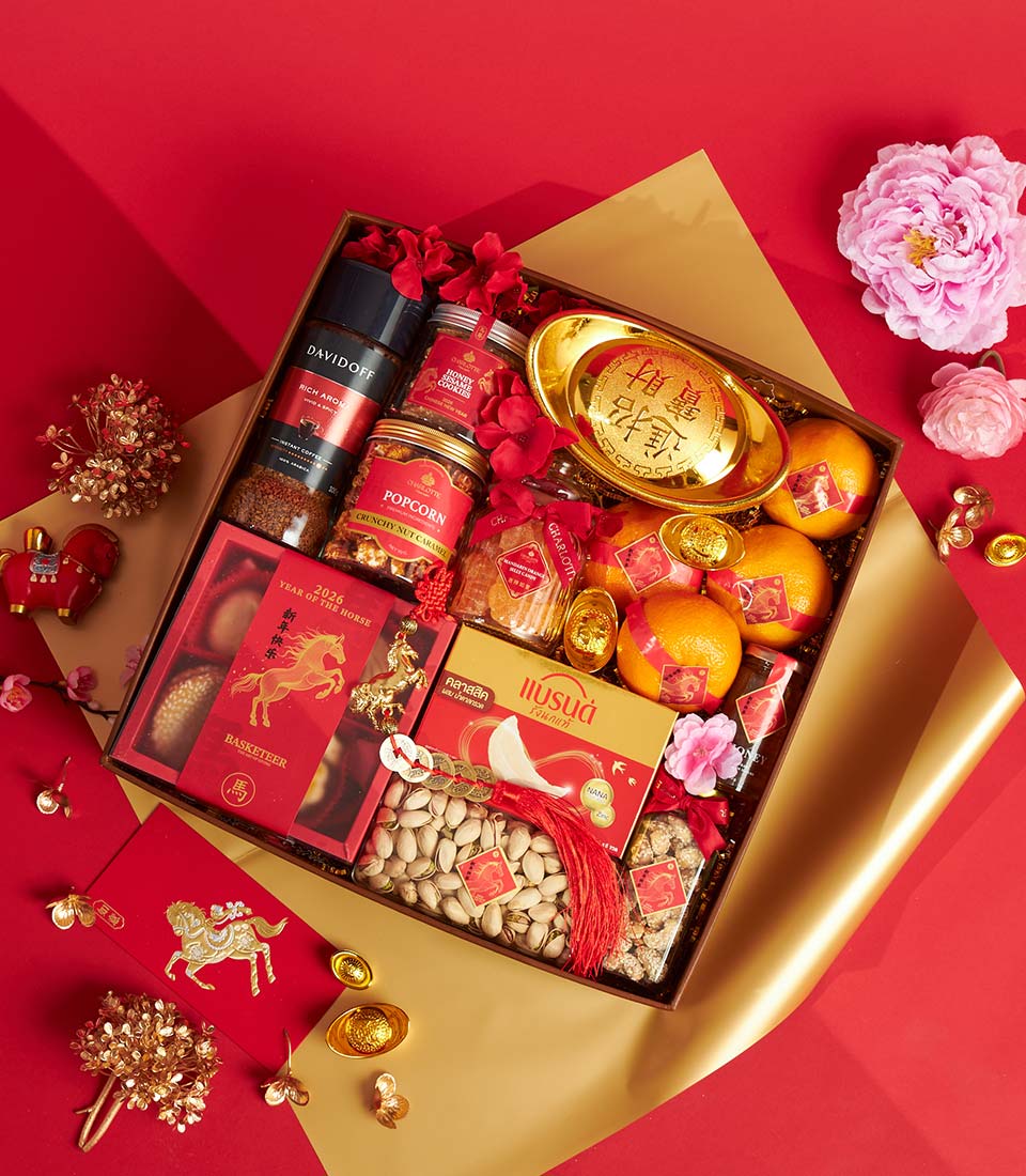 Luxury Chinese New Year hamper with mandarin oranges, gourmet treats, and golden prosperity symbols on red silk backdrop