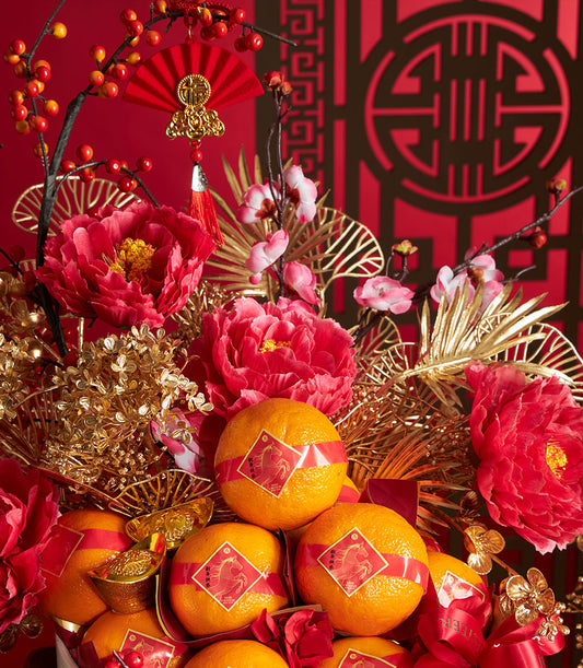 Vibrant Chinese New Year mandarin orange basket with red peonies, golden accents, and festive horse-year ribbons