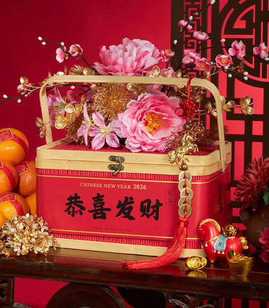 Festive Chinese New Year gift box with pink peonies, mandarin oranges, and gold horse charms for 2026