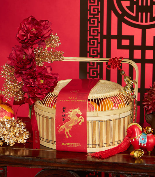 Red and gold Chinese New Year mandarin orange gift basket with peonies, horse charm, and lucky coins for 2026 Year of the