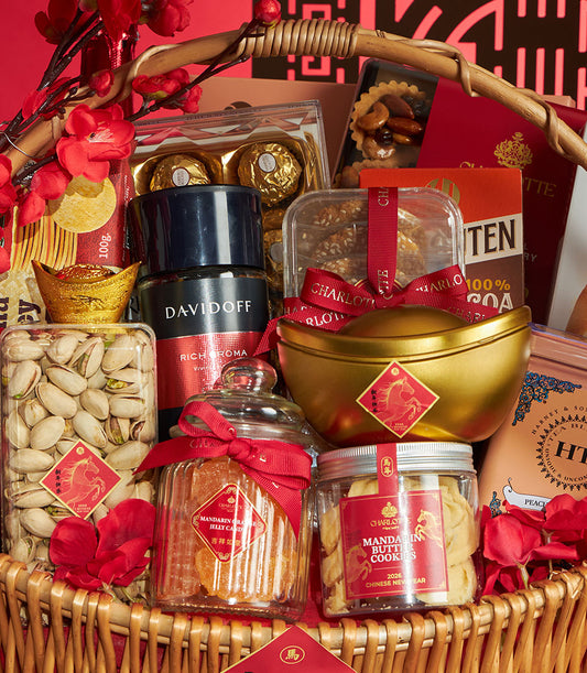 Festive Chinese New Year gourmet gift basket with pistachios, mandarin sweets, Ferrero Rocher, and premium coffee