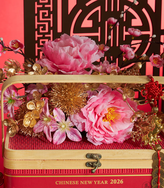 Luxury red mandarin orange gift box with pink peonies and golden accents for Chinese New Year