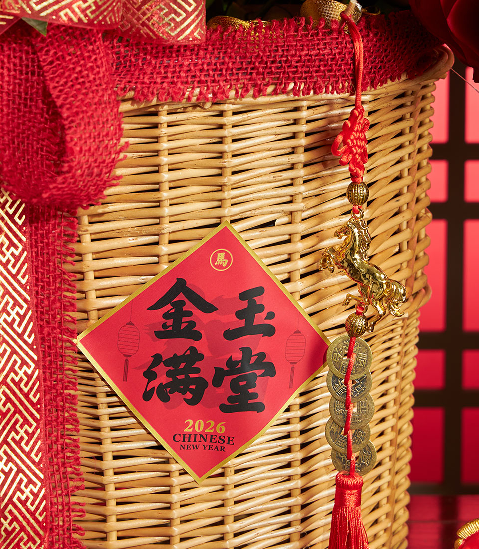 Woven wicker gift basket with red ribbon, Chinese New Year diamond decoration, and golden horse charm for festive