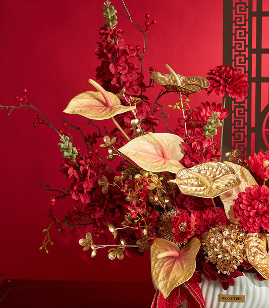 Basketeer luxury gift: A striking Chinese New Year floral arrangement in red and gold, with anthuriums, in decorative vase. Premium hamper delivery Thailand.