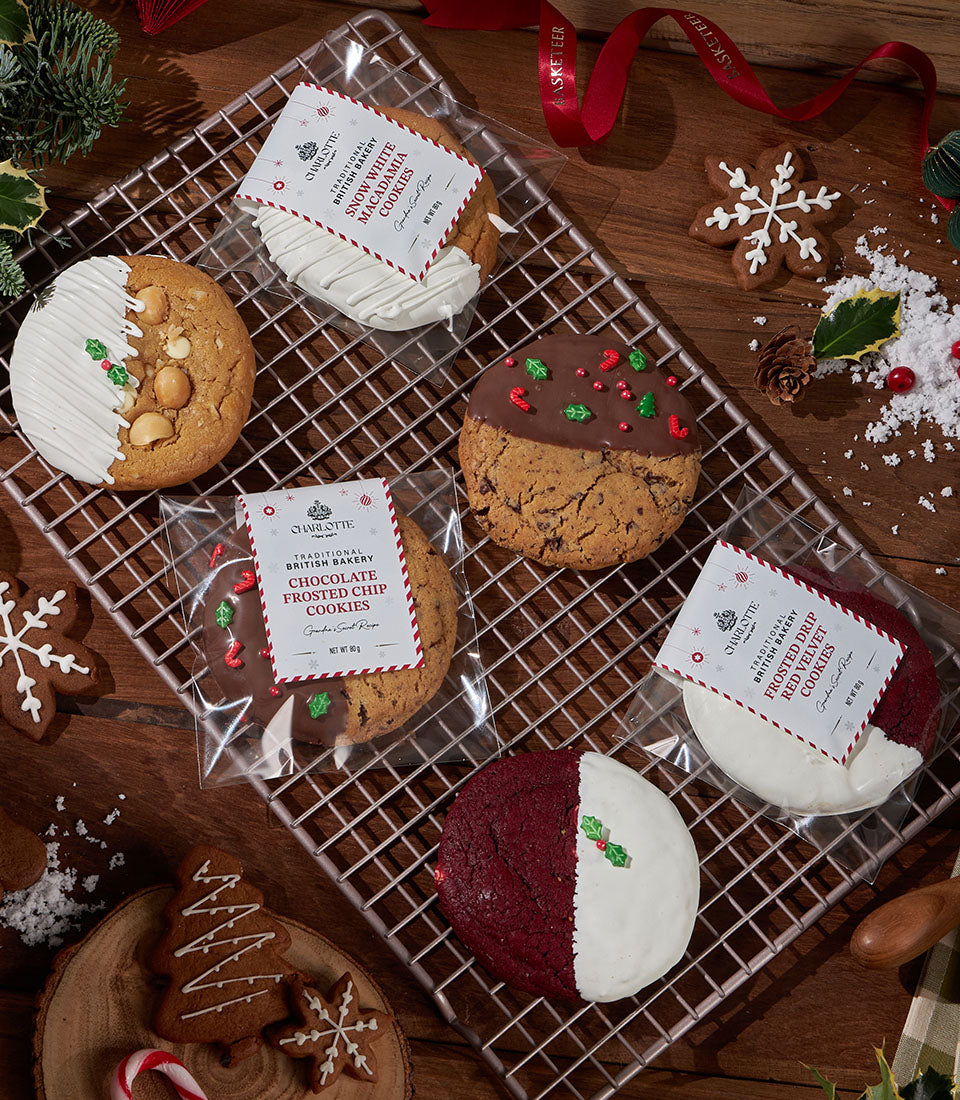 Festive British soft cookies with frosting and sprinkles on cooling rack, holiday gift box