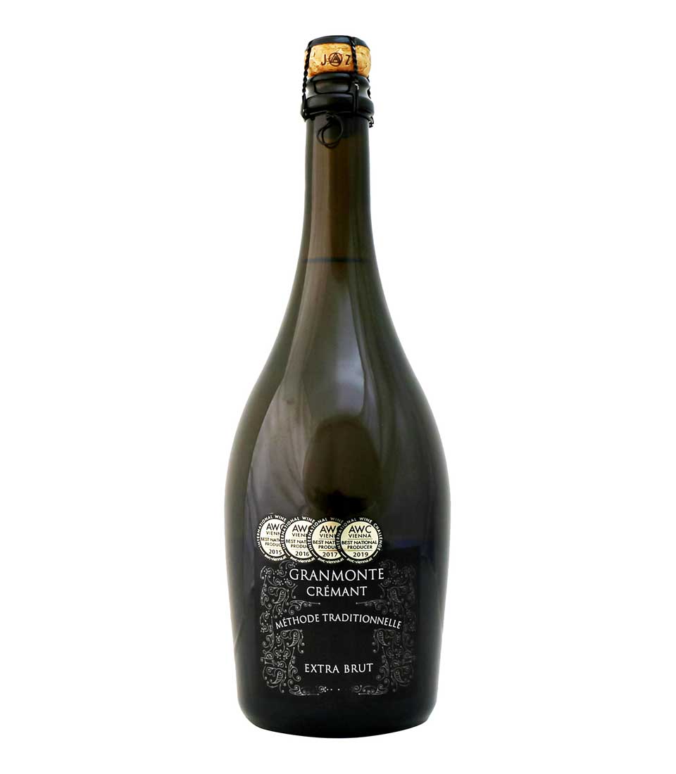 Cremant Methode Traditionnelle Extra Brut sparkling wine with gold foil cap and award medals
