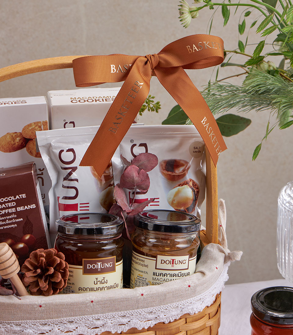 Woven gift basket with DoiTung macadamia cookies, nuts, chocolate coffee beans, honey and macadamia spread