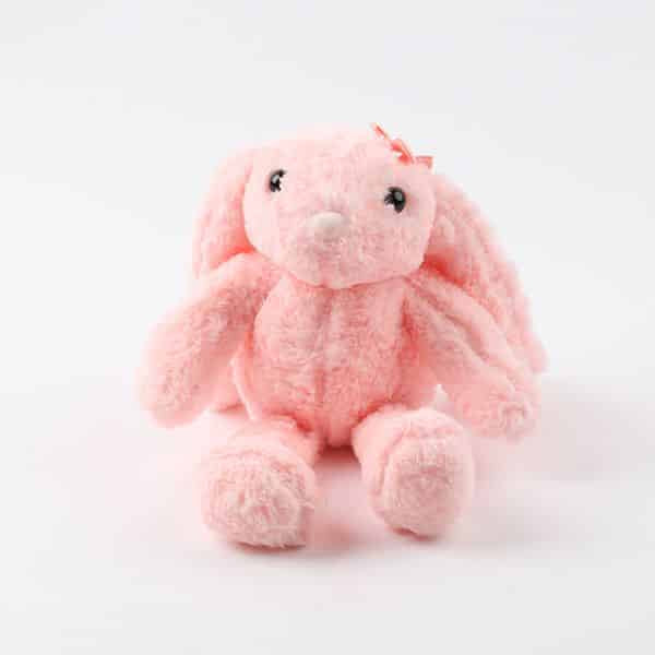 Soft pink plush bunny with floppy ears and bow for gifting