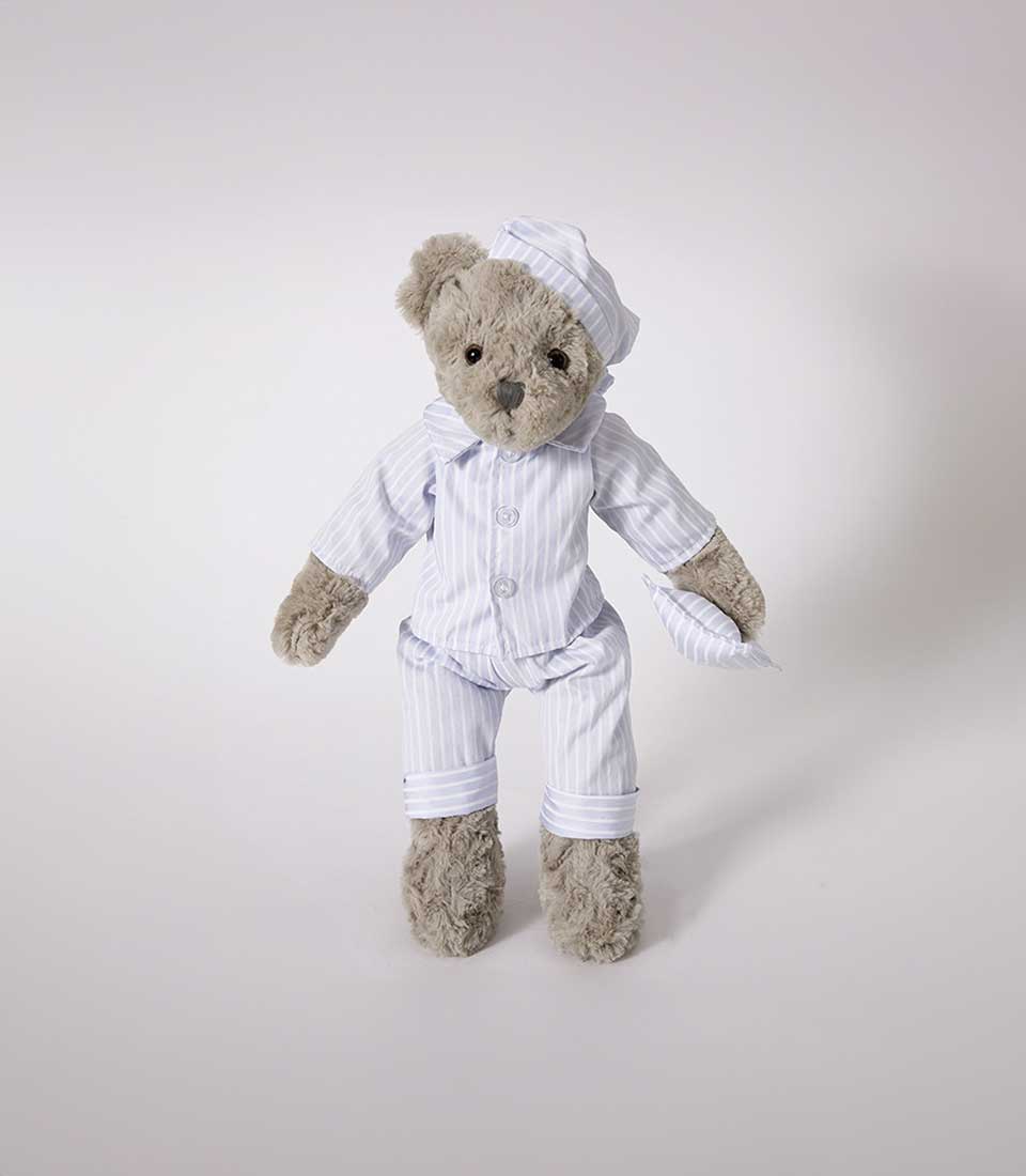 Plush teddy bear in light blue striped pajamas with matching sleep cap and pillow, 42 cm