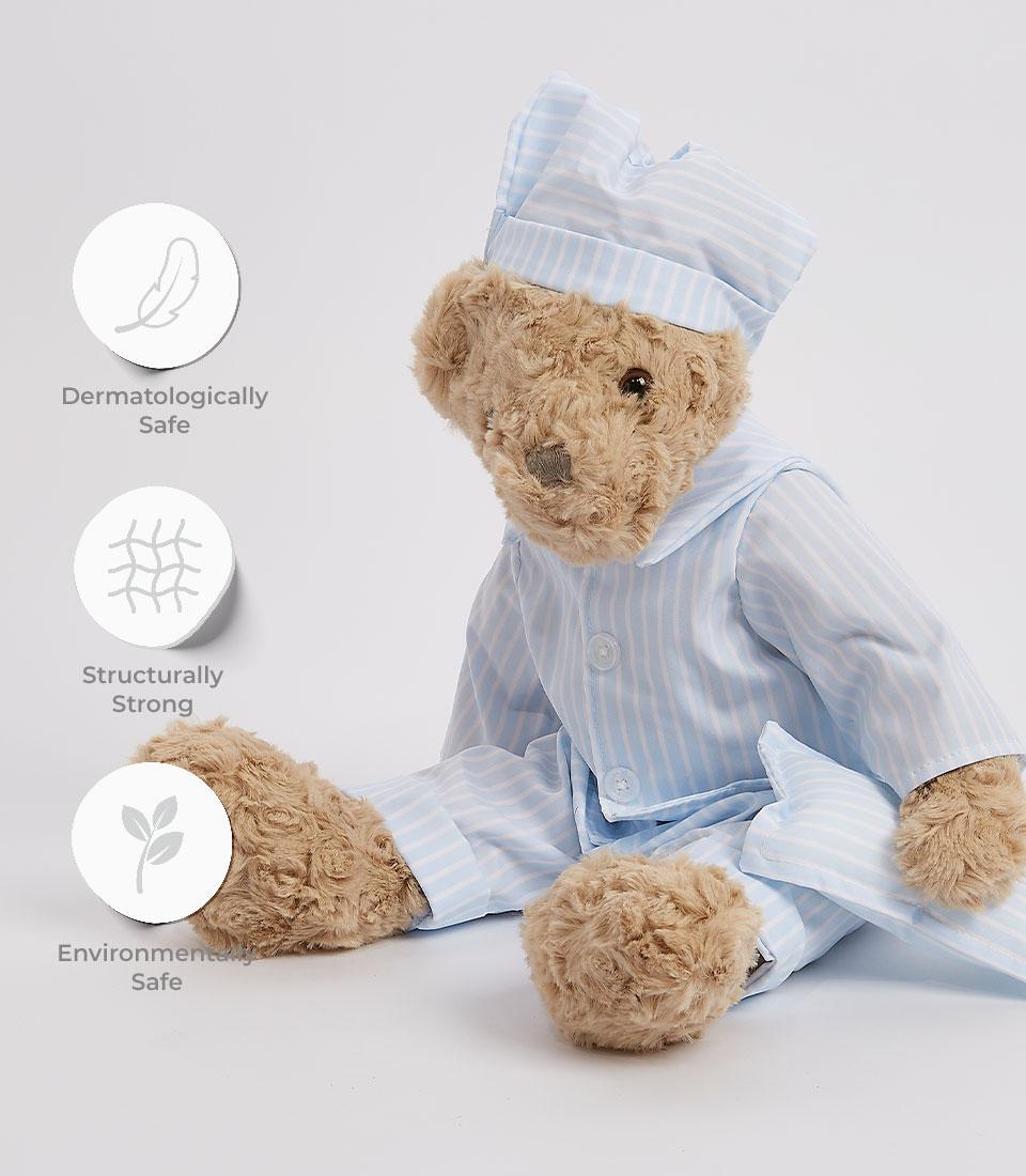 Basketeer: A cuddly teddy bear in striped pajamas, part of a premium baby gift set in Bangkok. A thoughtful hamper for same-day gift delivery in Thailand.