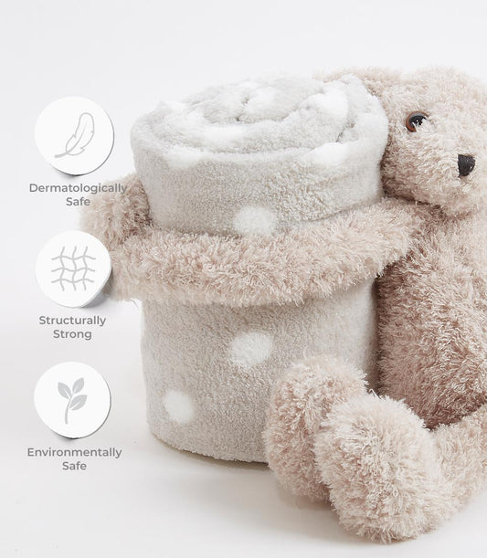 Soft brown plush teddy bear hugging cream polka-dot baby blanket, dermatologically and environmentally safe gift set