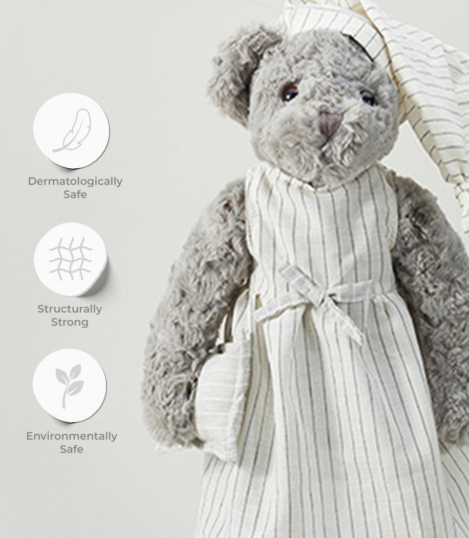 Soft grey teddy bear in white and grey striped nightgown with bonnet, dermatologically safe and eco-friendly plush toy for