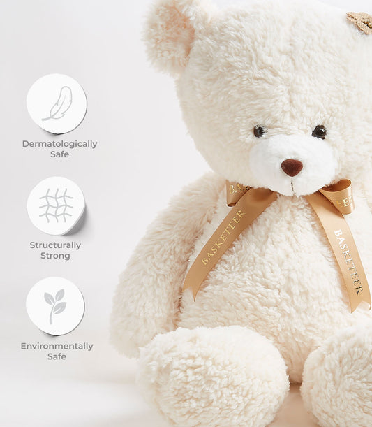 Cream fluffy teddy bear with brown nose, gold Basketeer ribbon bow, dermatologically safe soft toy for kids