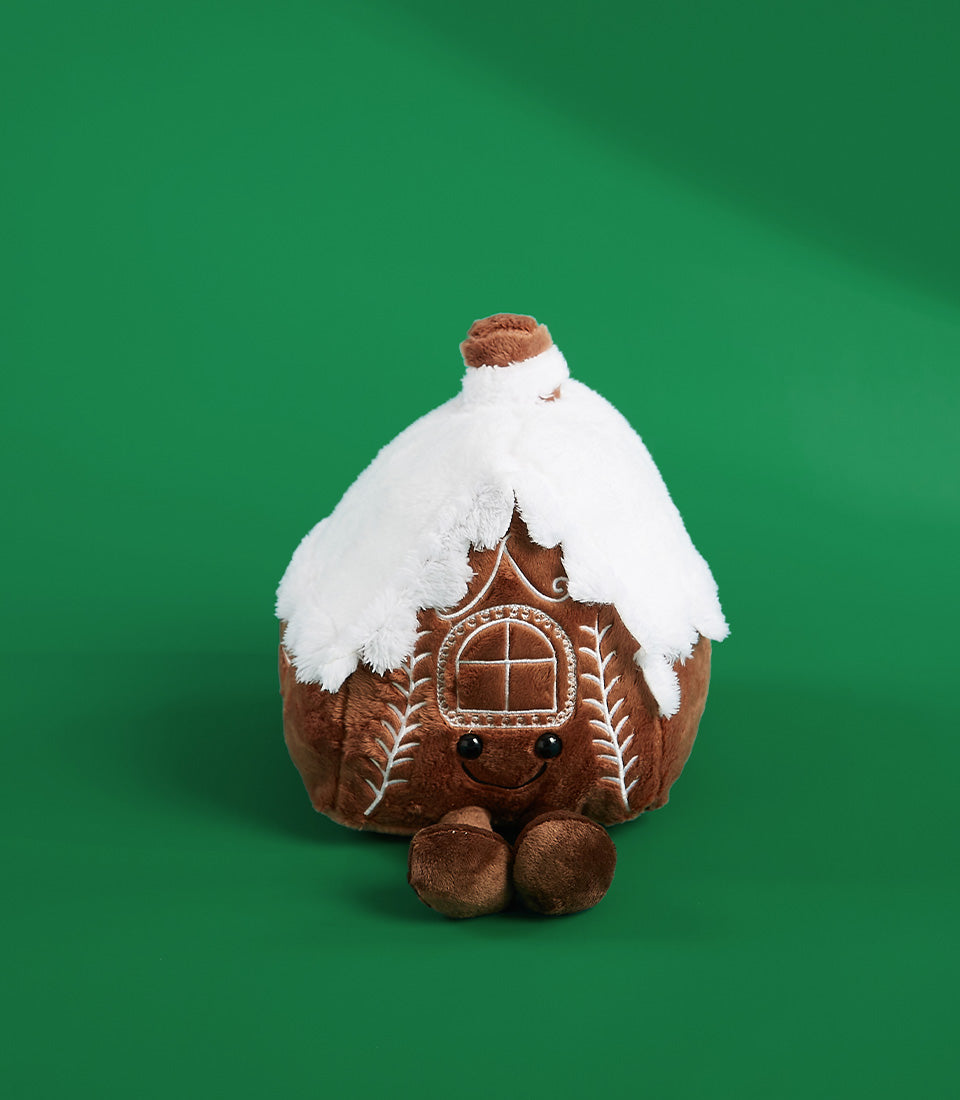Basketeer add-on gift: Adorable gingerbread house plush toy with snowy roof detail. Perfect for a Bangkok hamper or luxury gift basket.