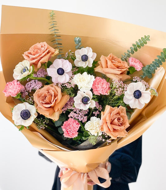 Toffee Dreamland Anemone Bouquet with peach roses, white anemones, and blush ribbon