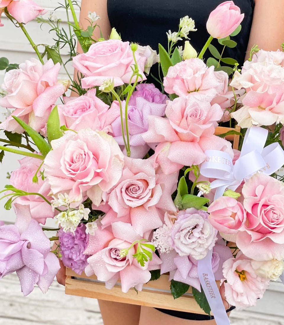 Pink and purple rose arrangement with tulips in wooden crate, fresh flower gift with satin ribbon