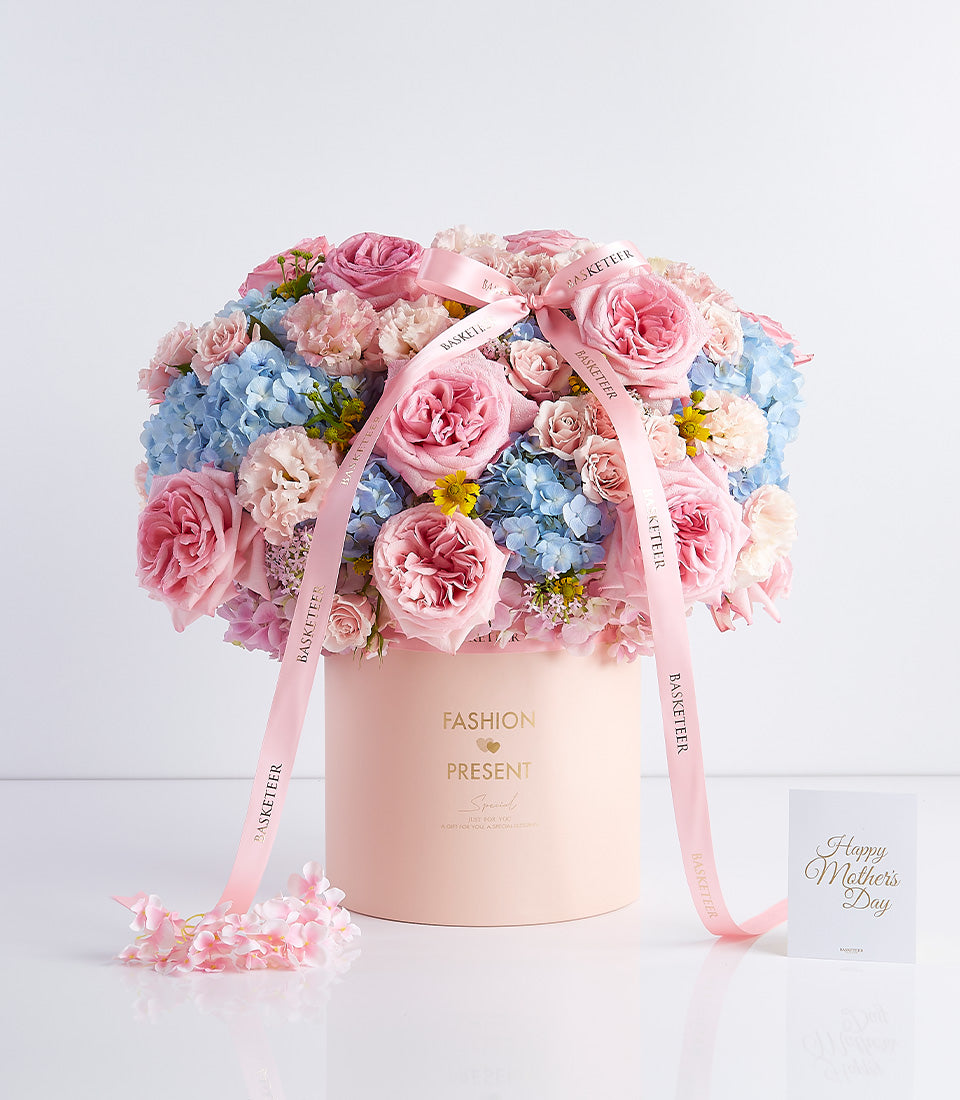 Pink rose and hydrangea Mother's Day flower hatbox with gold ribbon and greeting card