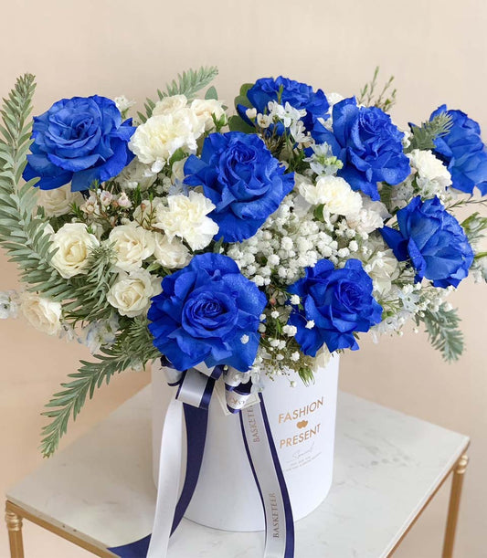 Blue and white roses with baby's breath in luxury cylindrical gift box, graduation flowers