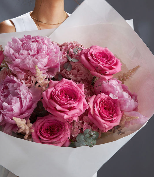 Premium pink peony and rose bouquet with hydrangeas, wrapped in soft paper for luxury gifting
