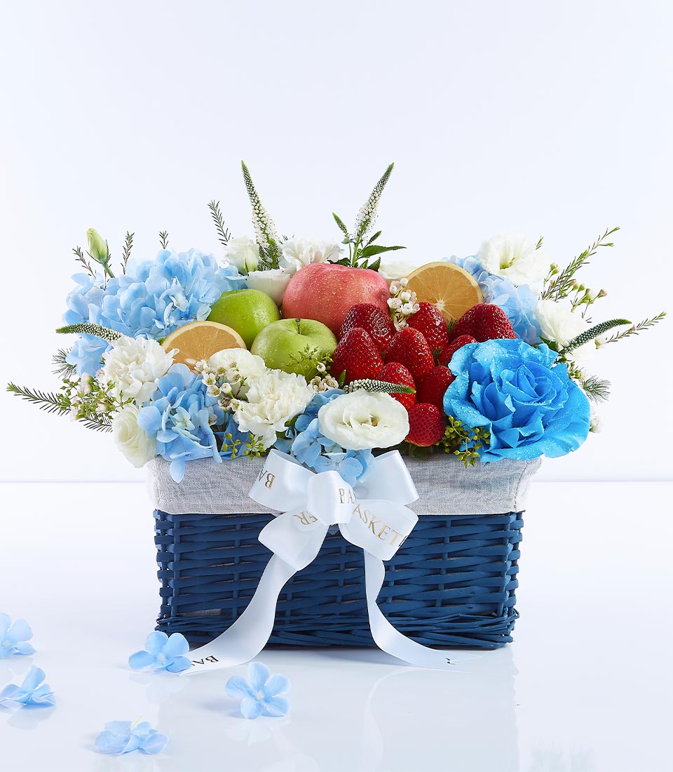 Ocean Breeze fruit and flower gift basket with hydrangeas, roses, strawberries, and apples for Mother's Day