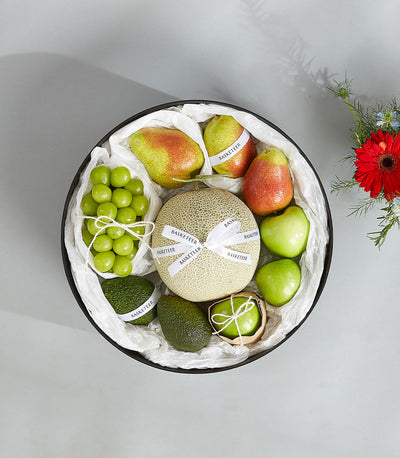 Premium green fruit gift basket with avocado, melon, pears and grapes in black Blooming Box