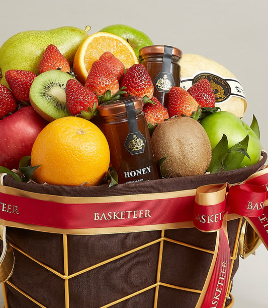 Premium fresh fruit and honey gift basket with apples, pears, oranges, kiwis, and strawberries