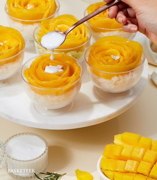 Mango sticky rice dessert cups with flower-shaped mango petals and coconut cream drizzle, artisan tropical treat gift set