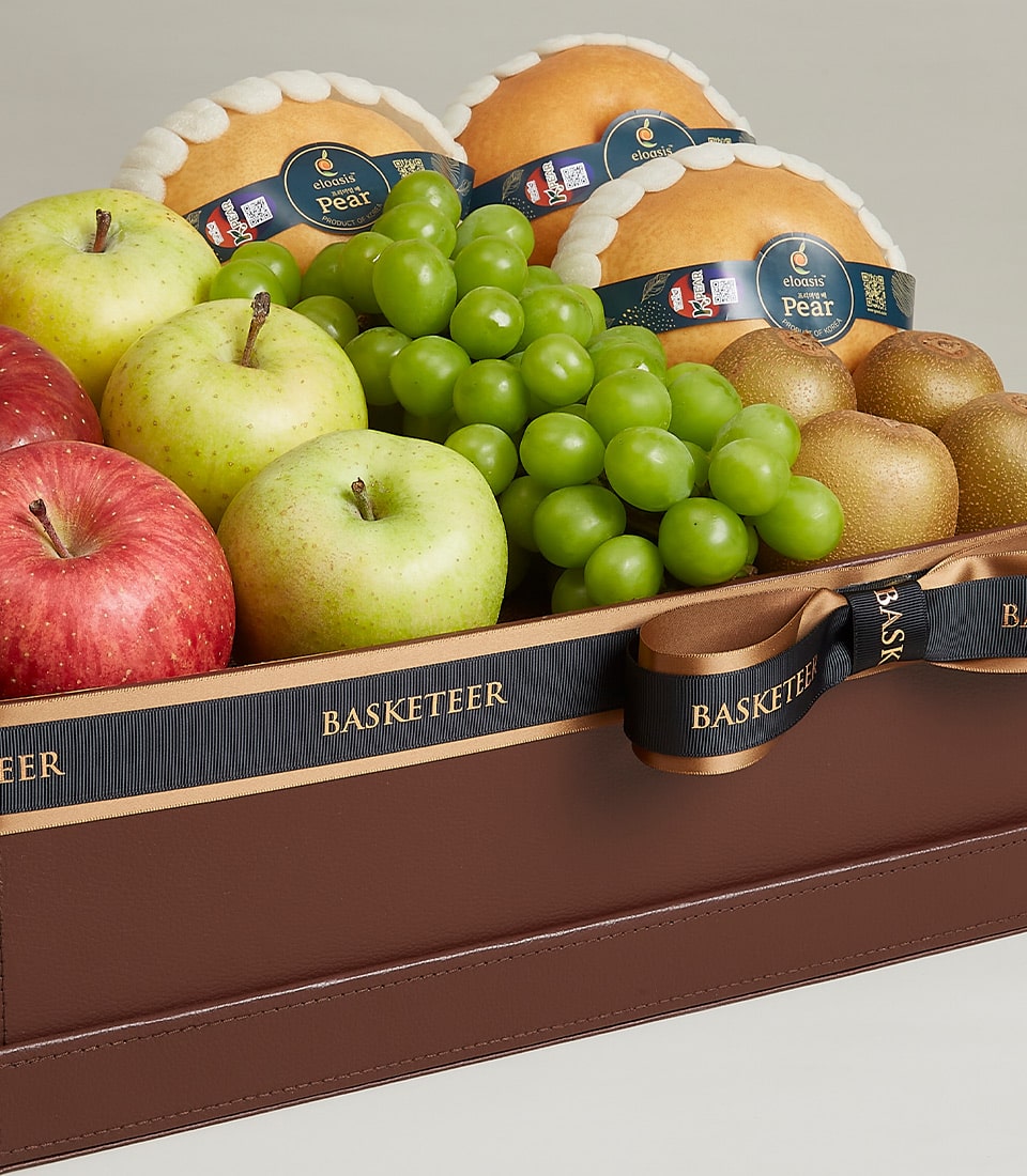 Basketeer luxury gift basket Bangkok with crisp apples, juicy grapes, and pears. Premium hamper delivery Thailand in a stylish brown box with ribbon.