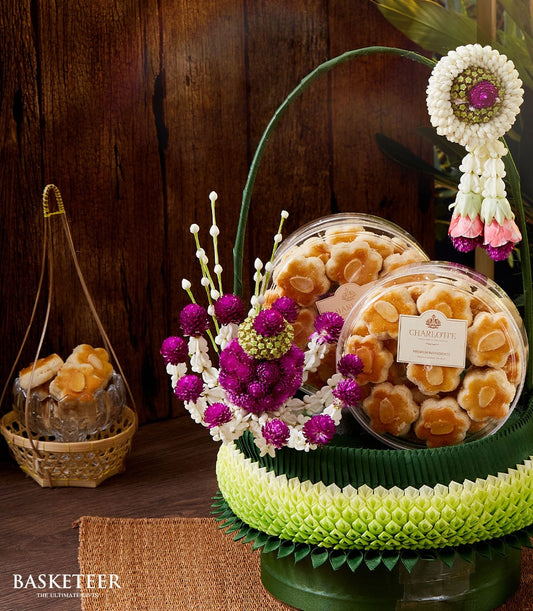 Thai Songkran cookies gift set with almond-topped flower shapes, purple amaranth, jasmine blooms, and traditional phuang