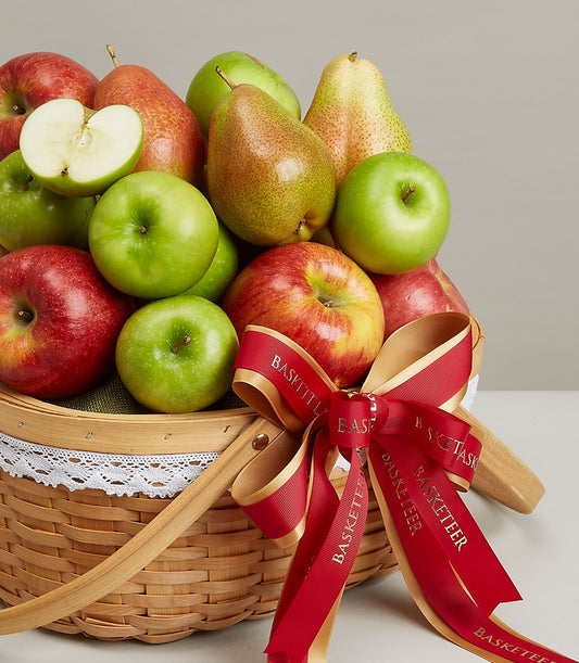 Deluxe wicker fruit hamper with fresh apples, pears, and green fabric lining, red ribbon bow