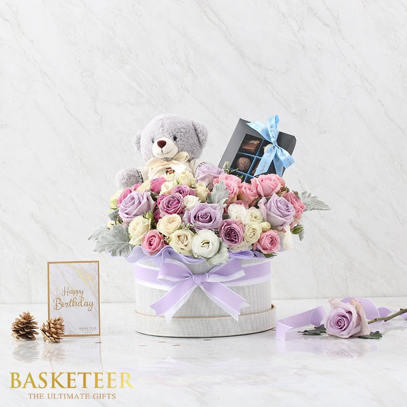 Luxury grey hatbox gift with lavender roses, teddy bear, and chocolates for birthday celebration