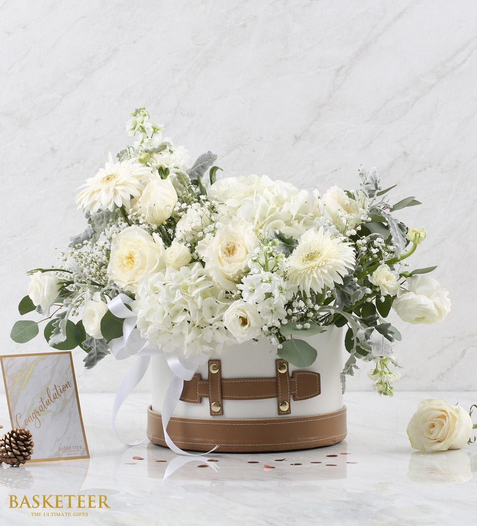 White roses and hydrangeas in luxury hatbox with satin ribbon, get well flowers arrangement