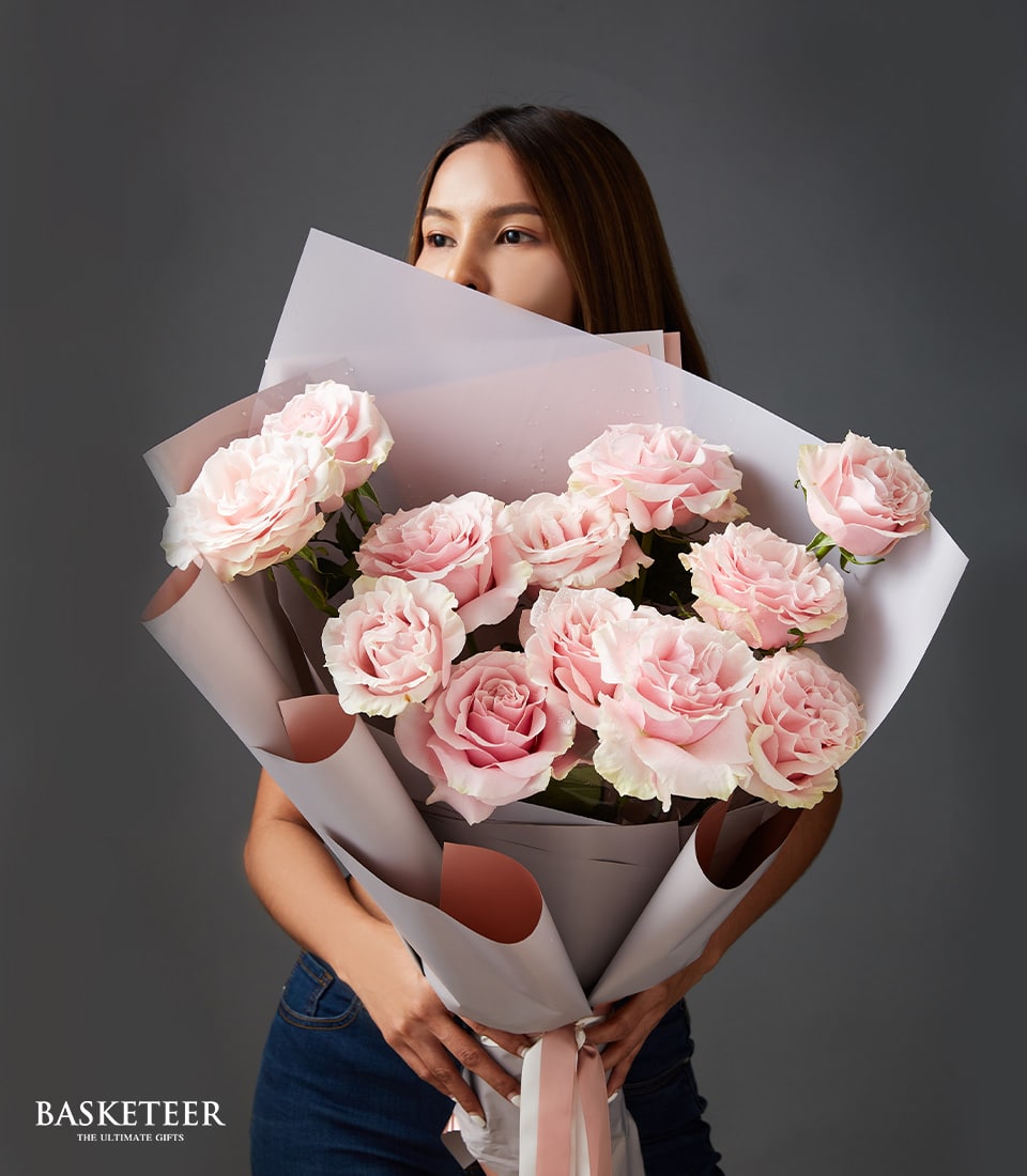 Fresh light pink Mondial roses bouquet with grey and pink wrapping, perfect for anniversaries and romantic gifts