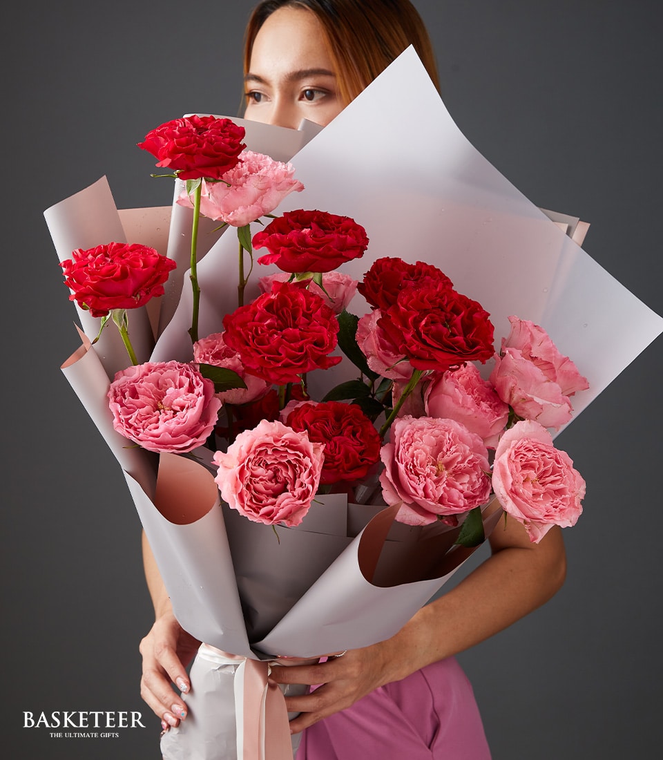 Red and pink rose bouquet with light gray wrap and pink ribbon, perfect Valentine's Day gift for her