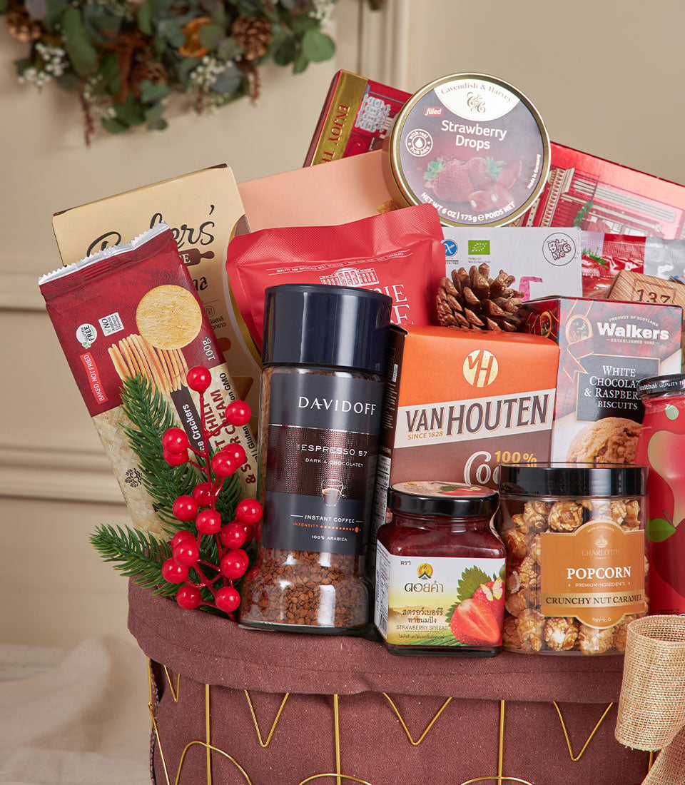 Deluxe red gourmet snack basket with coffee, cocoa, and caramel popcorn for New Year gifting