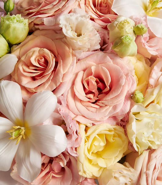 Serene Grace mixed bouquet with peach and pink roses, white flowers, and fresh green buds
