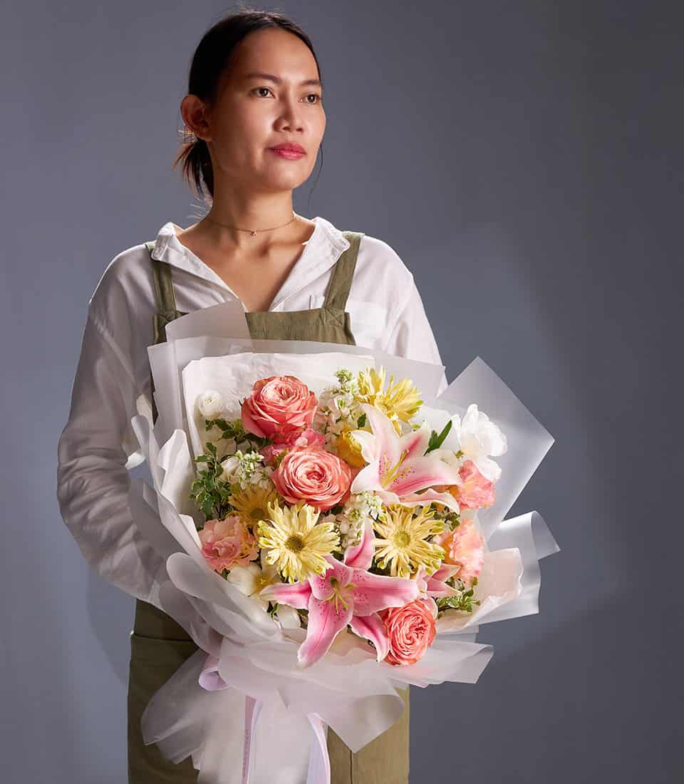 Pink lilies and peach roses champagne bouquet for anniversaries and special celebrations