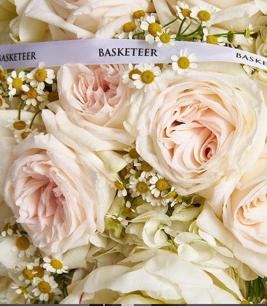 Ivory Bloom mixed bouquet with light pink roses, white hydrangeas, and chamomile flowers