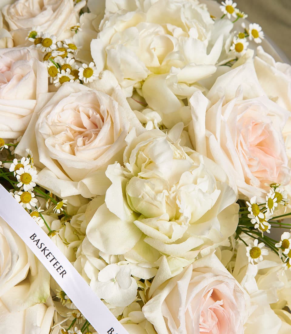Ivory Bloom Mixed Bouquet with white roses, light pink roses, white peonies, and chamomile flowers