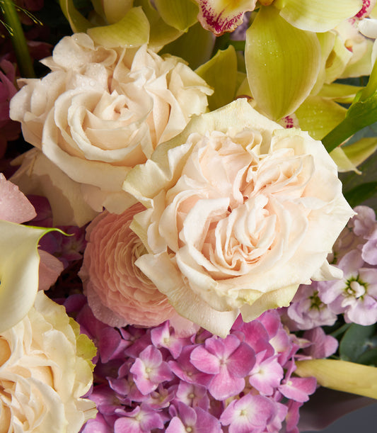 Luxury peach rose and deep pink hydrangea bouquet with orchids and calla lily