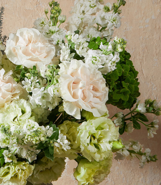 Premium fresh rose and carnation bouquet in cream, white, and soft green with lush foliage