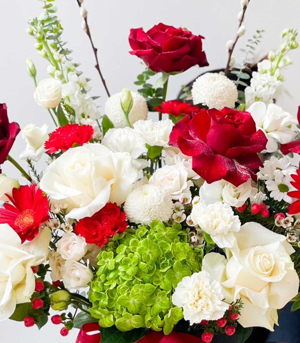 Red and white rose bouquet with carnations, chrysanthemums, and hydrangeas in premium gift arrangement