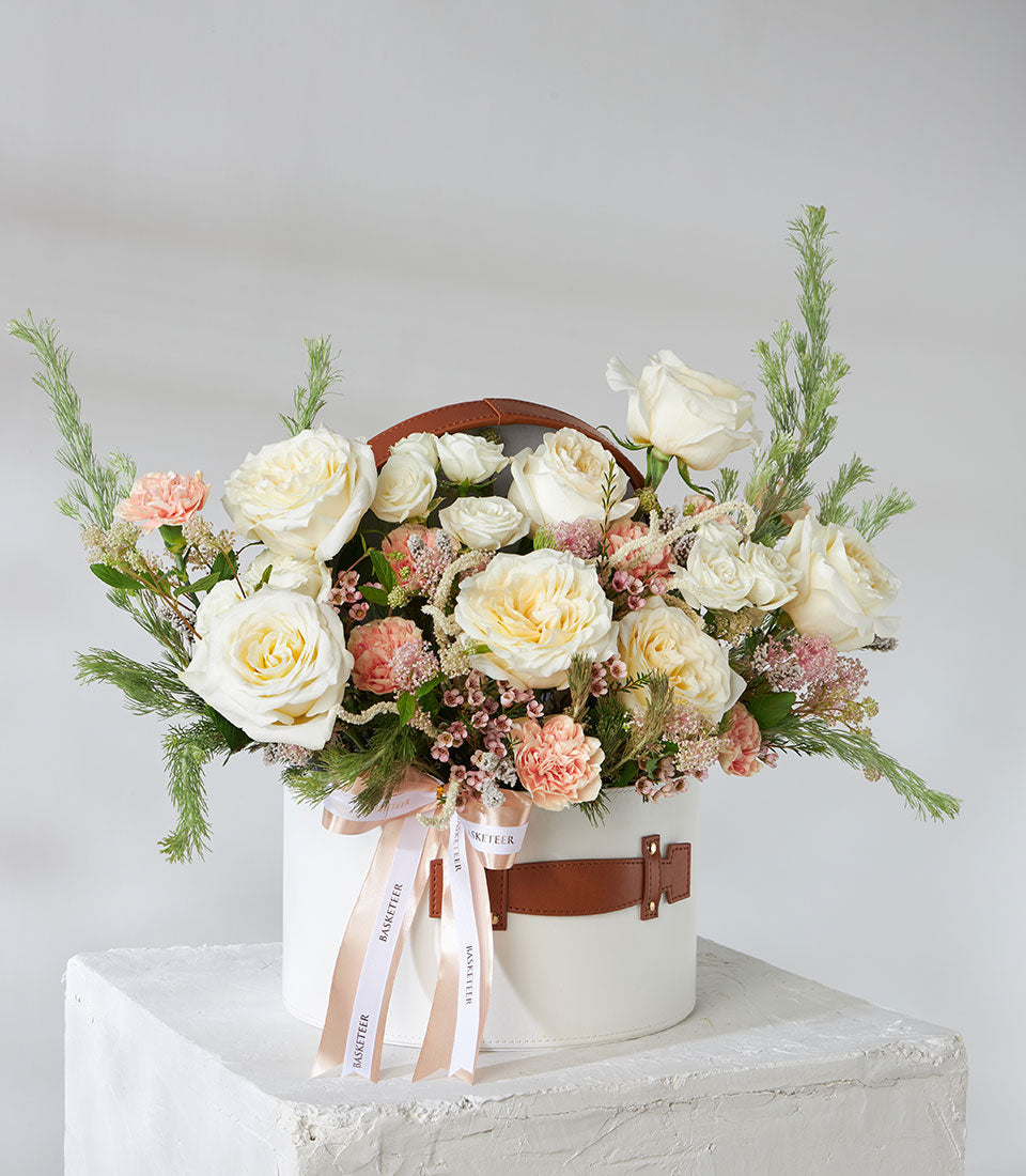 Luxury rose and carnation bouquet in cream leather hatbox with peach satin ribbon