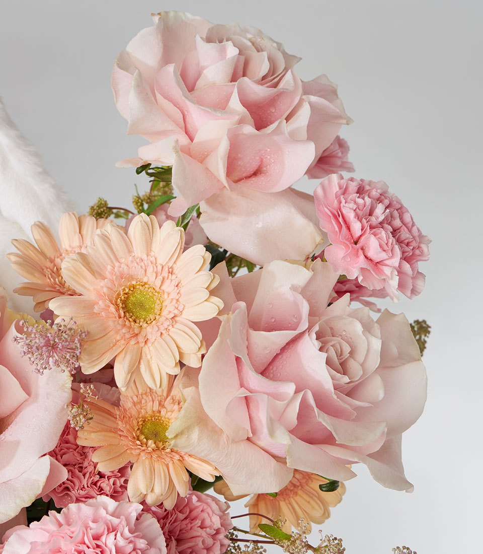 Pink Mondial roses and snow bunny plush in fresh flower gift box