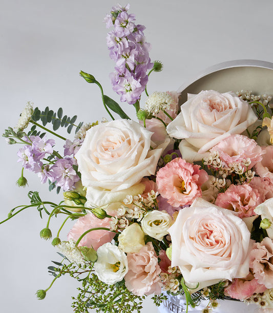 White O'Hara roses and pastel lisianthus luxury flower box with eucalyptus greenery