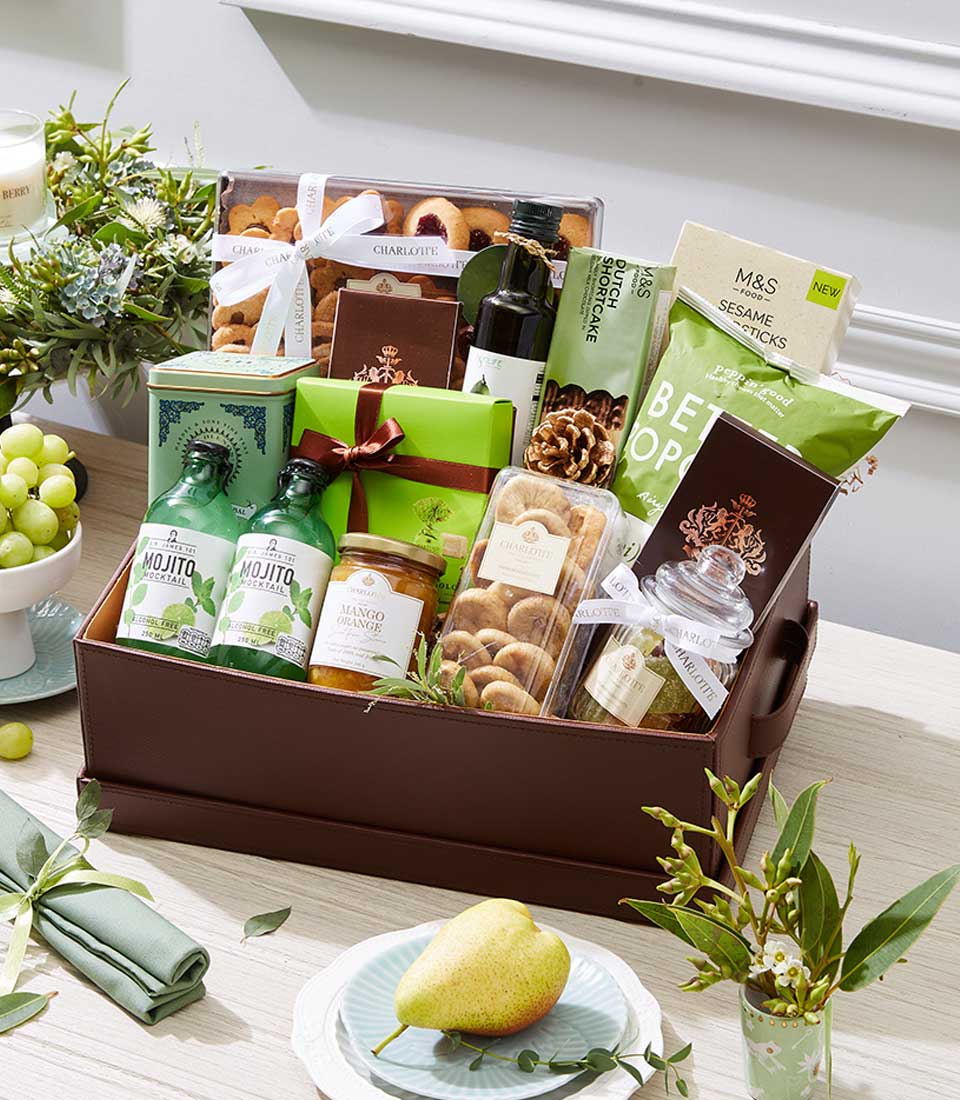 Luxury wellness gift hamper with mojito mocktail, gourmet spreads, dried figs, Dutch shortcake, and artisan treats in brown