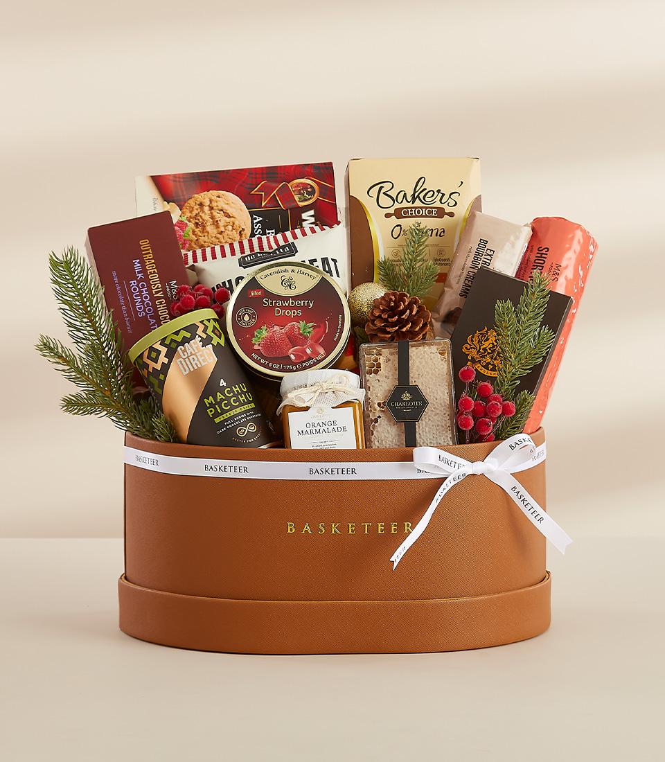 Premium New Year gift basket with gourmet treats, cookies, coffee, and chocolate in faux leather box with white ribbon
